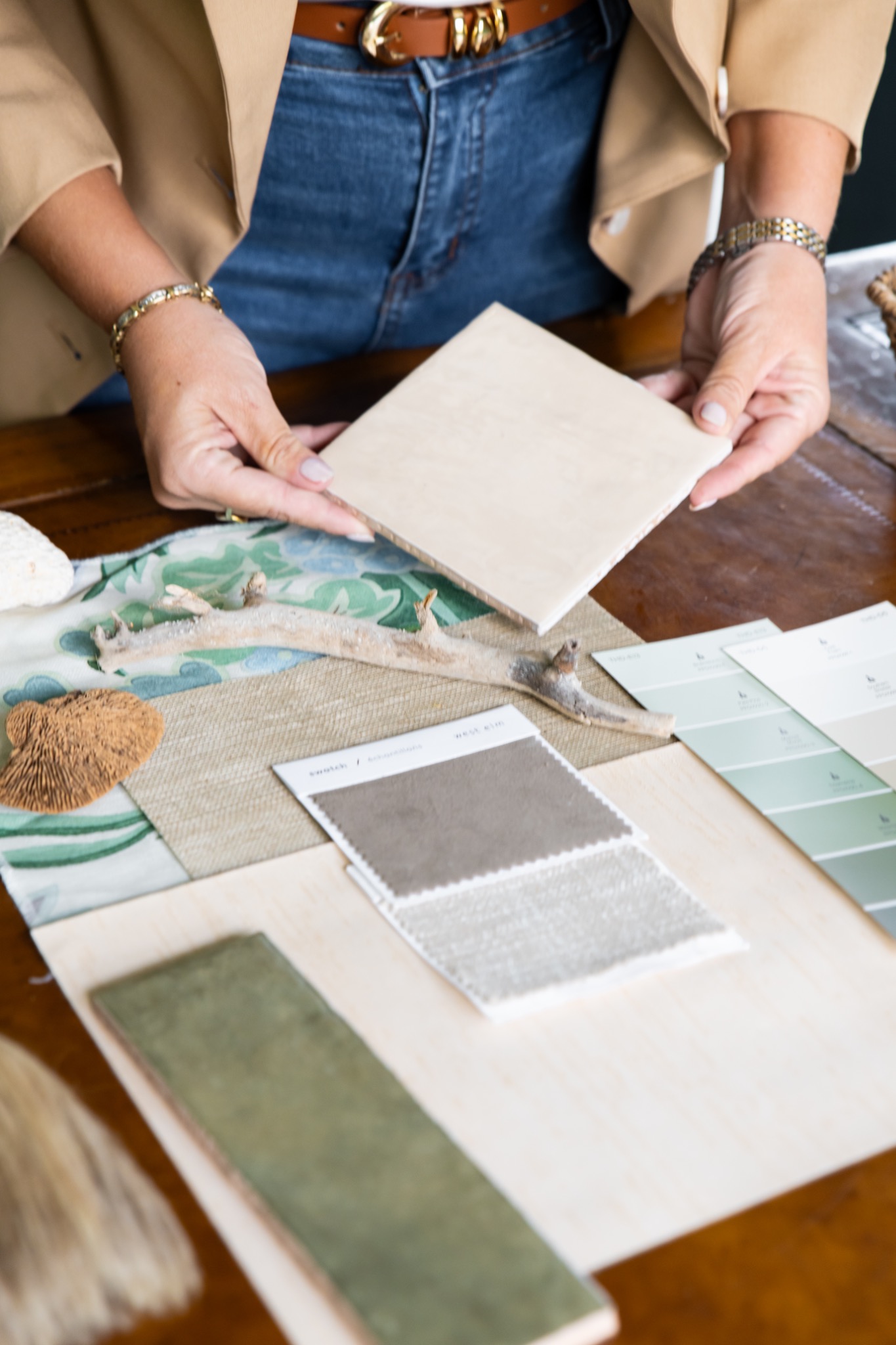 Kimberly reviewing design materials and finish samples